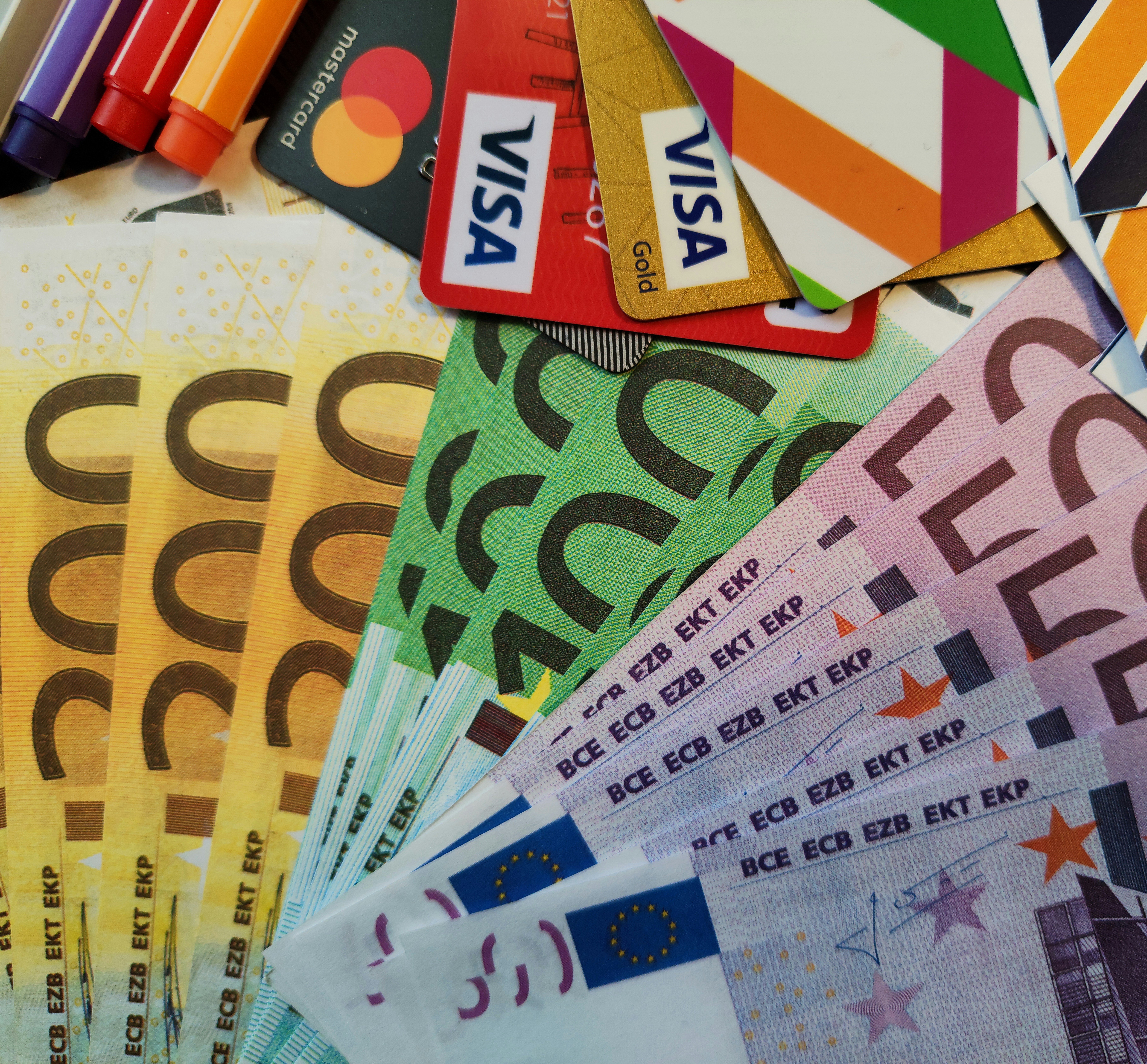 European financial and banking concept. Closeup shot of European paper money, euro currency banknotes, hundred, two hundred and five hundred euro bills and credit cards
